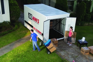 Two people packing a Go Mini's moving and storage container